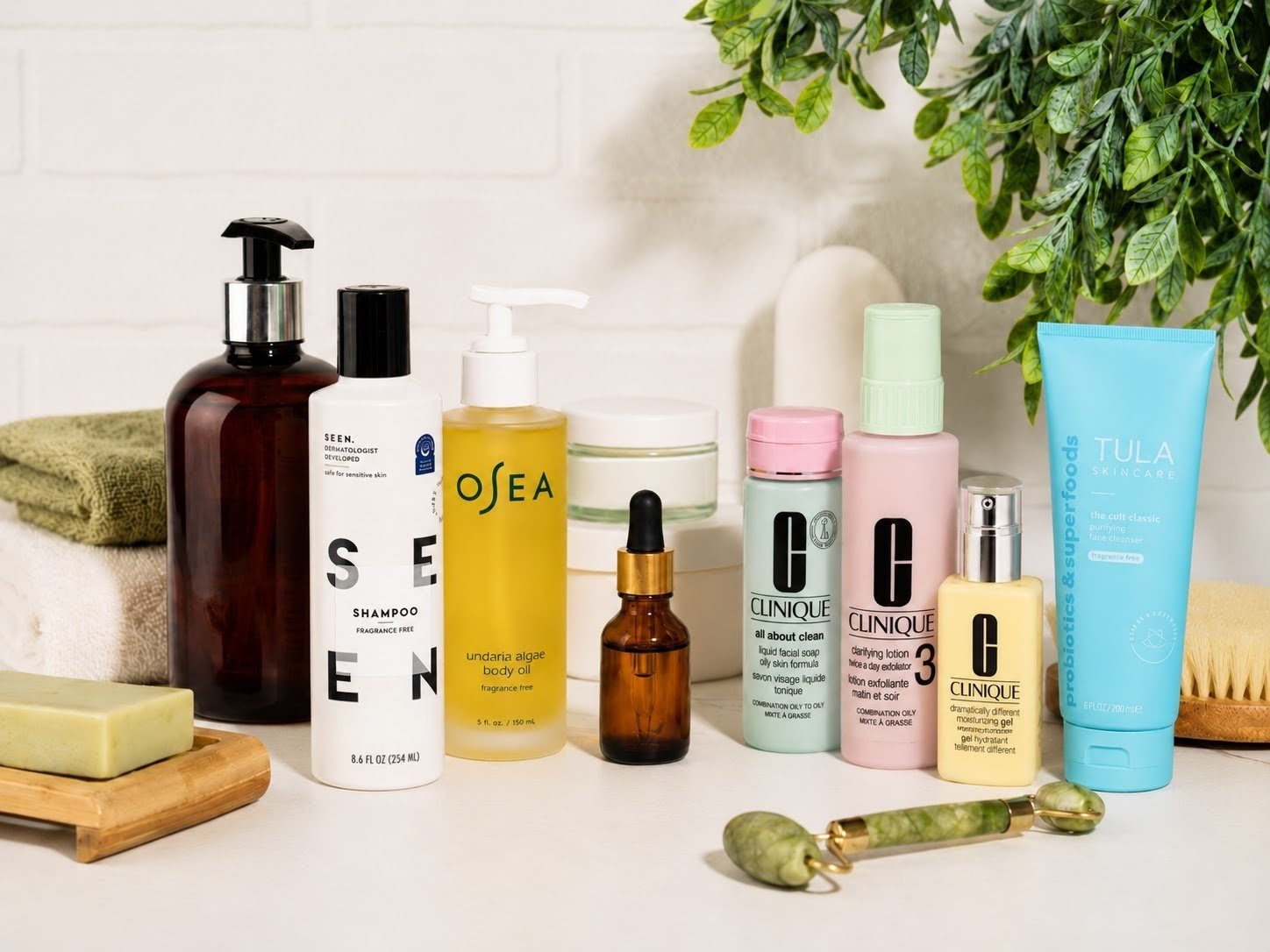 A lineup of fragrance-free personal care products including shampoo, body oil, facial cleansers, and moisturizers